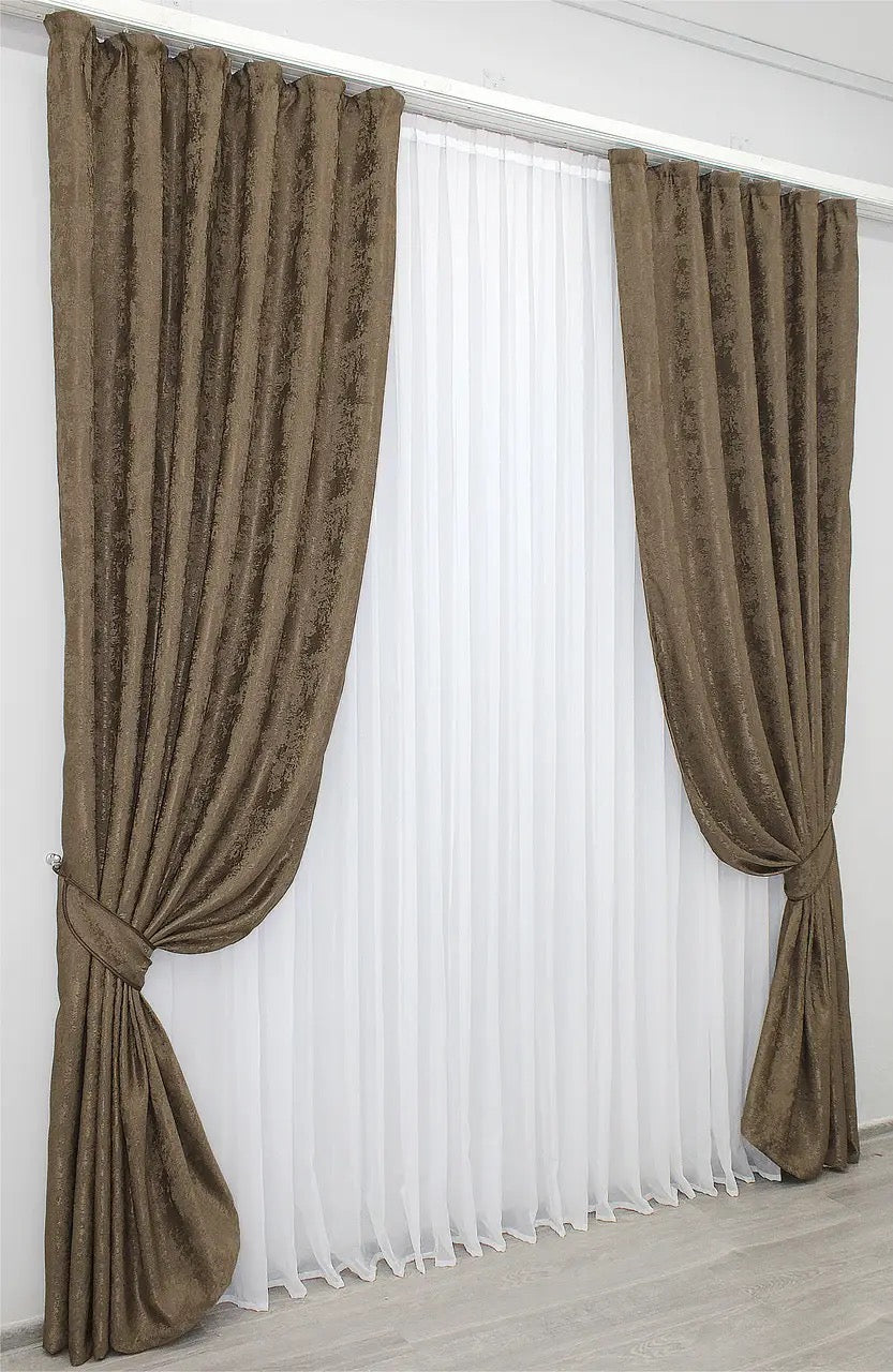 Stylish brown jacquard curtains designed for privacy and light filtering, allowing soft natural light to create a cozy ambiance.
