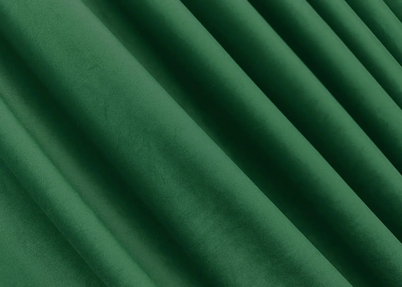 Classic dark green velvet curtains with premium plush fabric, perfect for a warm and inviting home ambiance.
