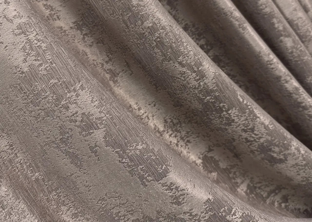 Soft taupe curtains with a classic woven pattern, enhancing bedrooms and living rooms with timeless sophistication.
