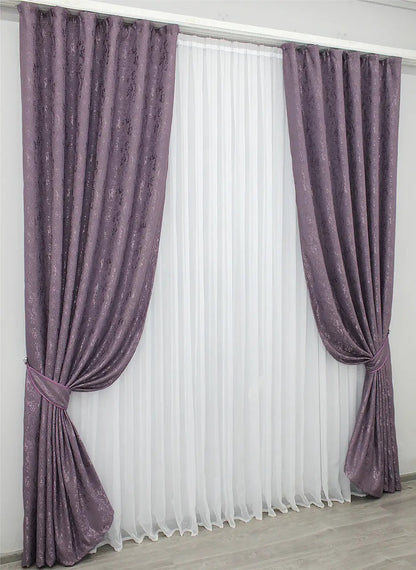 Elegant purple linen curtains with light-filtering fabric, enhancing warmth and depth in any room.
