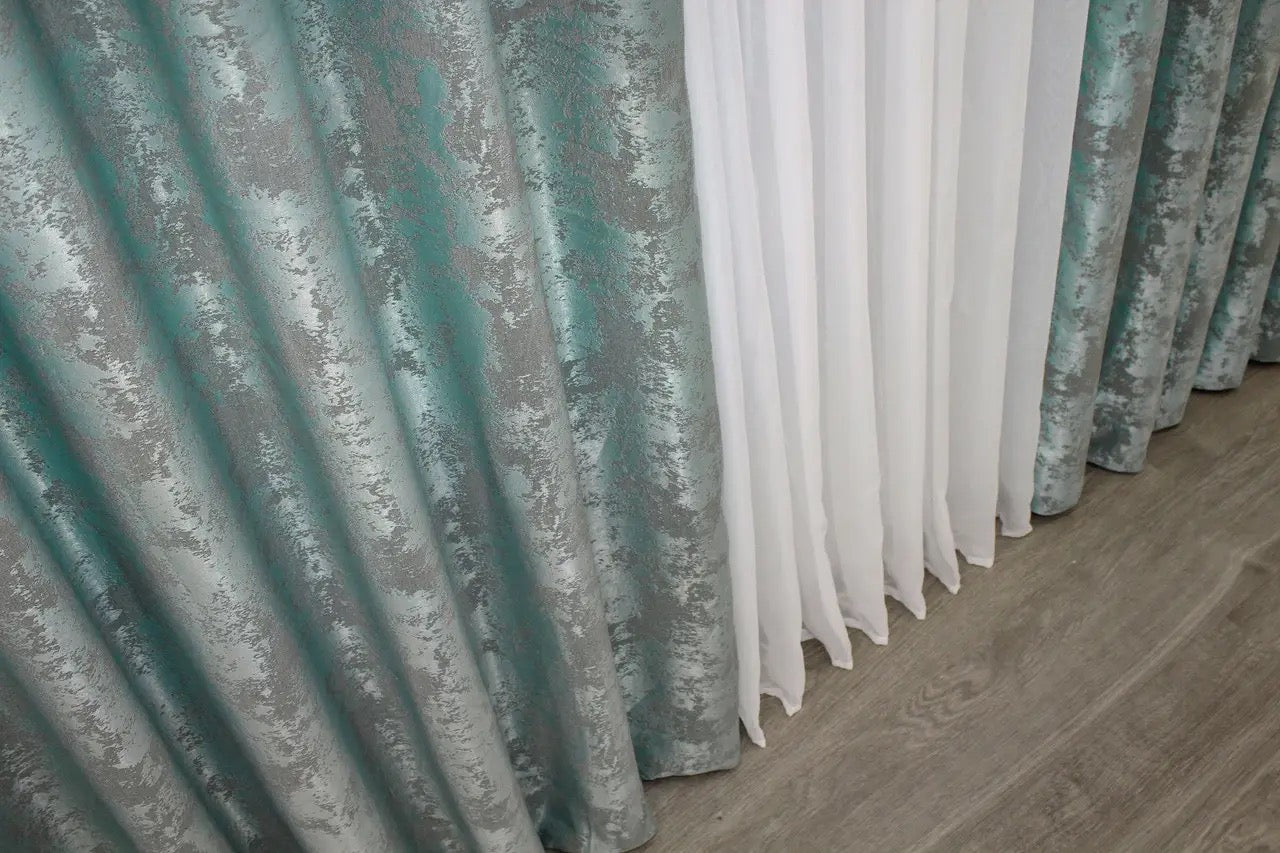 Luxurious birch teal curtains with a rich jacquard texture, adding warmth and depth to any home décor.
