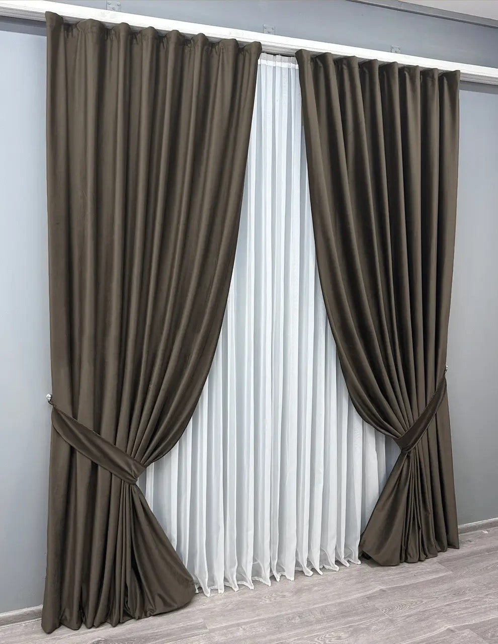 Rich walnut-colored velvet blackout curtains, perfect for creating a cozy and stylish interior with thermal insulation and noise reduction.
