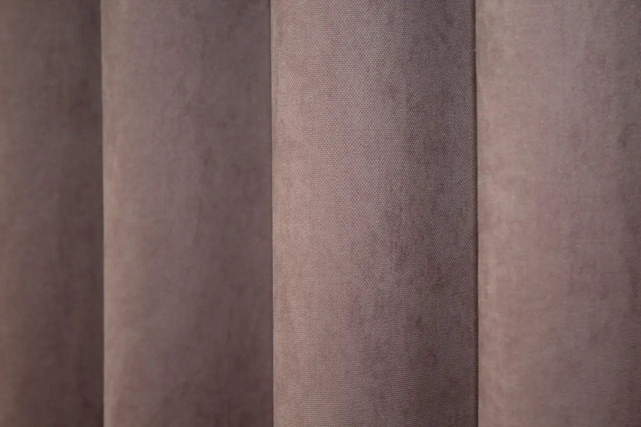 Timeless rose pink microvelvet curtains, creating a sophisticated and warm interior setting.
