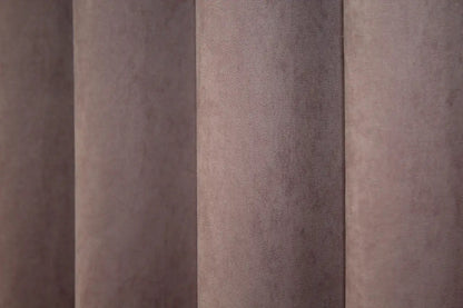 Timeless rose pink microvelvet curtains, creating a sophisticated and warm interior setting.
