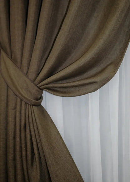 Soft brown textured linen curtains with a breathable weave, designed for eco-friendly home styling.
