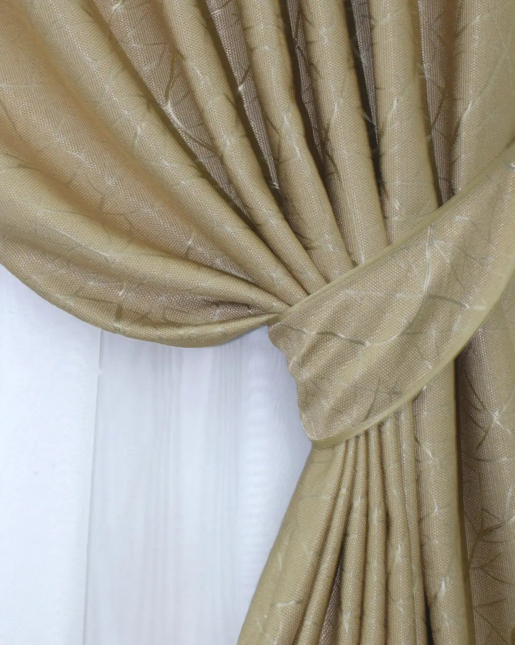 High-quality linen drapes in a warm stone tone, creating a cosy and stylish living space with breathable fabric.
