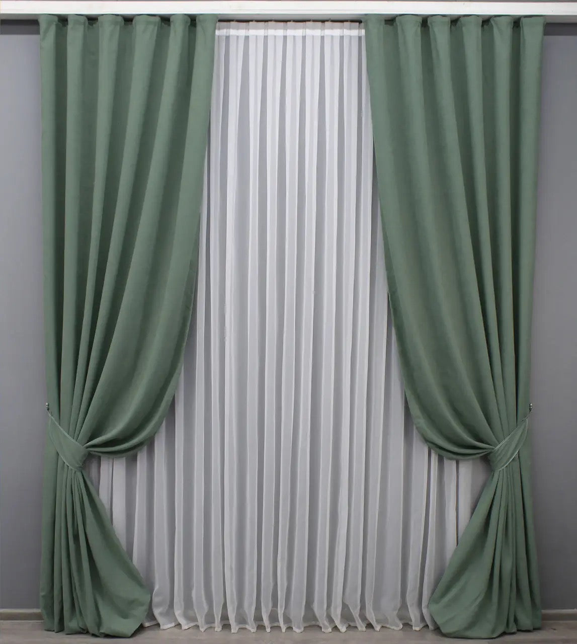 Luxury sage green velvet curtains with a rich texture, ideal for stylish living rooms and bedrooms.
