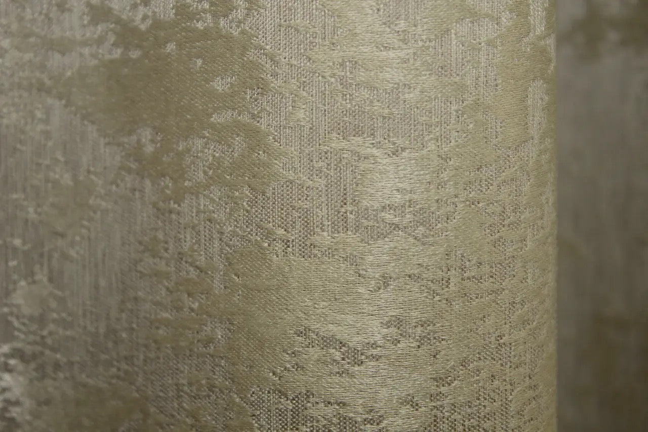 Rich golden jacquard curtains with an intricate woven pattern, designed to enhance any room with sophistication.
