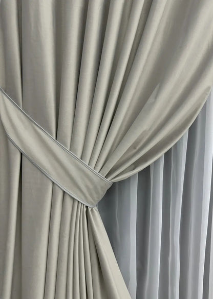 Ivory satin velvet blackout drapes with a refined, timeless appeal, ideal for adding elegance and warmth to any interior.
