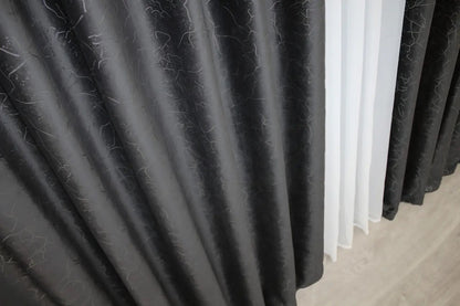 Smokey black velvet curtains with a contemporary marbled design, ideal for bedrooms, living rooms, and stylish interiors.
