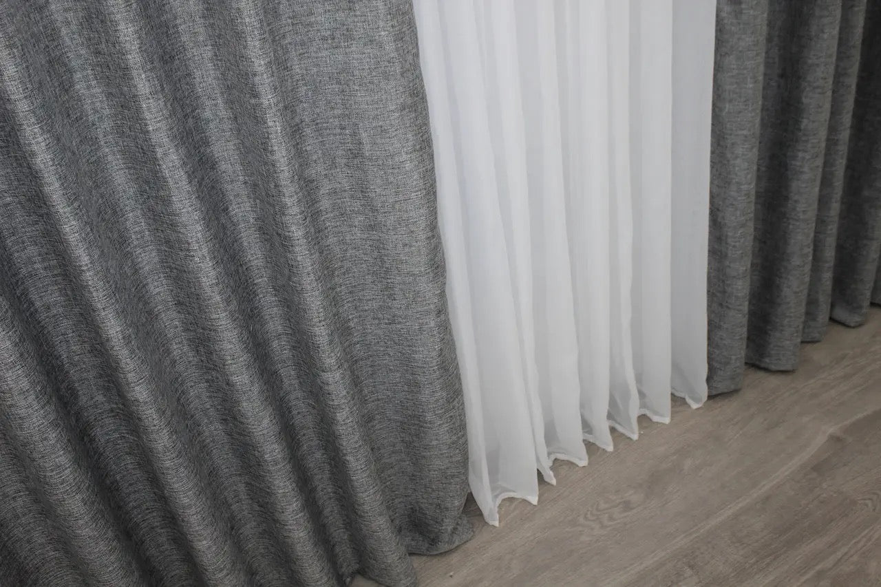 Smoky grey linen curtains with a natural texture, enhancing warmth and coziness in any living space.
