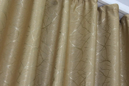 Muted taupe linen drapes with a relaxed and effortless aesthetic, perfect for understated elegance in a home setting.
