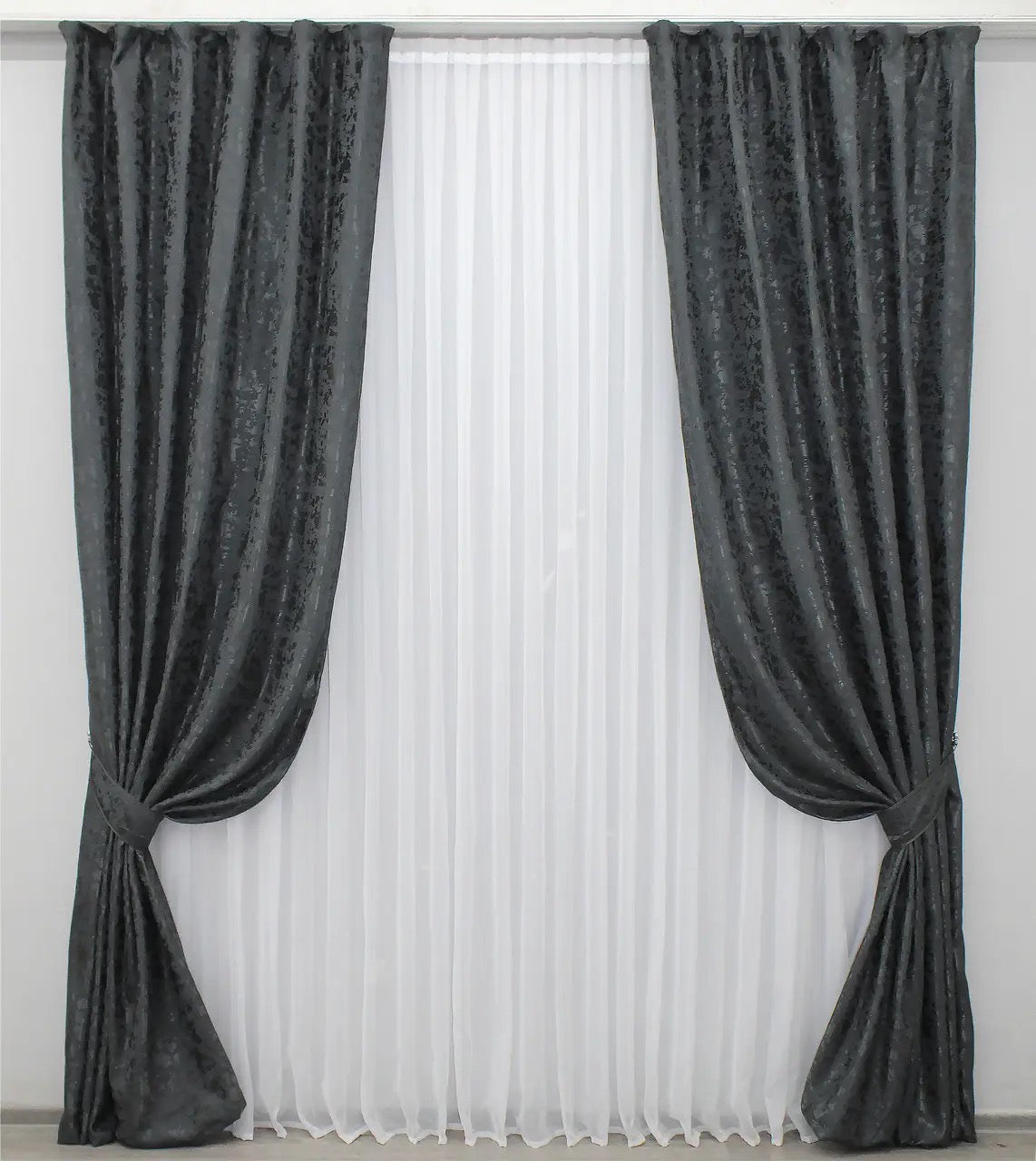 Soft blue-graphite linen drapes with a delicate marble texture, perfect for stylish and contemporary home decor.
