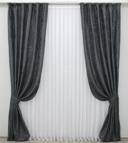 Soft blue-graphite linen drapes with a delicate marble texture, perfect for stylish and contemporary home decor.
