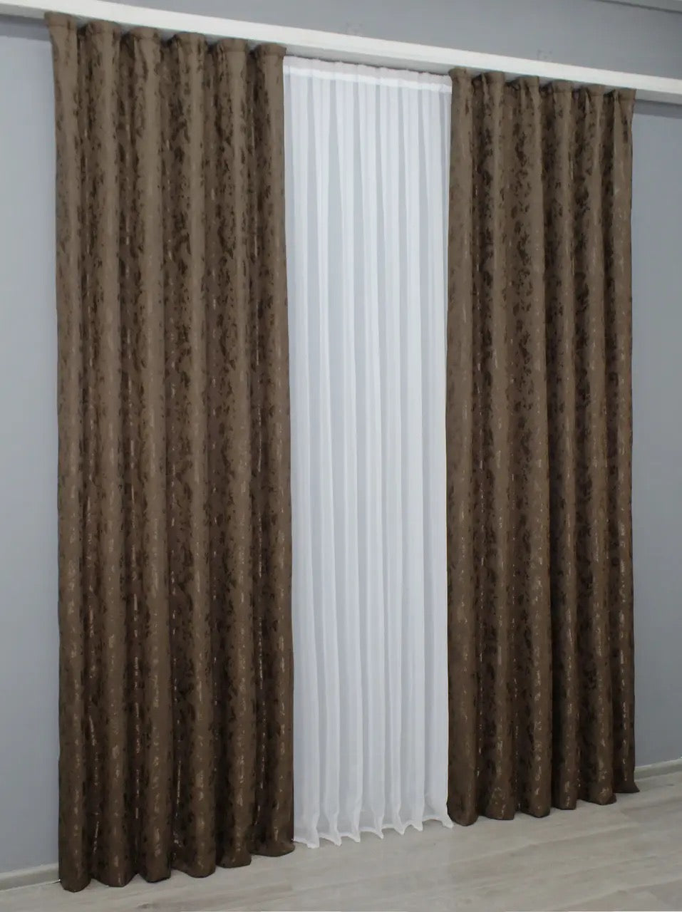 Light-filtering brown linen curtains, allowing privacy while maintaining a warm and natural glow.
