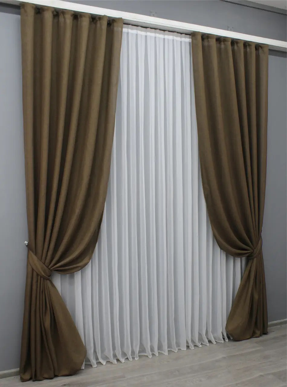 Warm brown coarse-woven linen curtains, adding depth and texture to cosy and elegant home spaces.
