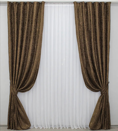 Soft brown linen drapes with a delicate marble texture, perfect for stylish and cosy home decor.

