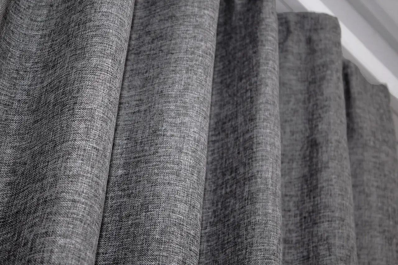 Soft burlap linen curtains in a neutral grey shade, ideal for modern, Scandinavian, and loft-style homes.
