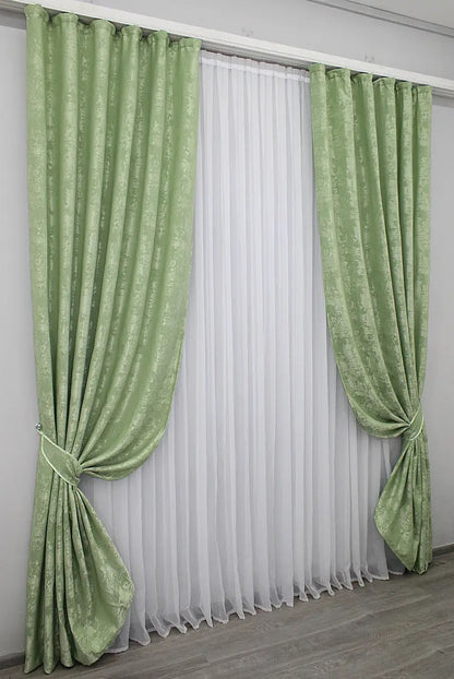 Stylish mint jacquard curtains designed with 70% light-blocking fabric for privacy while allowing soft natural light.
