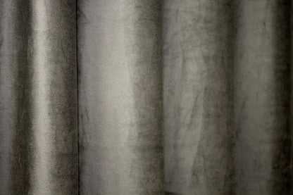 Moss green velvet blackout curtains for a cozy atmosphere in any space, designed to block light and offer privacy.
