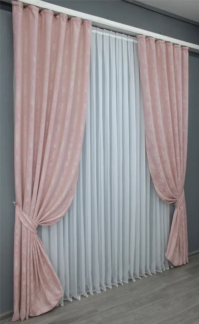 Stylish pale pink curtains designed with a subtle, sophisticated tone, ideal for modern and classic interior styles.
