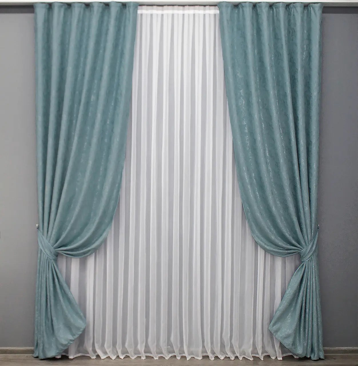 Soft sky blue linen drapes with a delicate textured fabric, perfect for airy and light-filled interiors.
