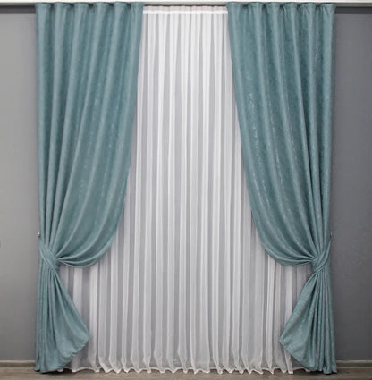 Soft sky blue linen drapes with a delicate textured fabric, perfect for airy and light-filled interiors.
