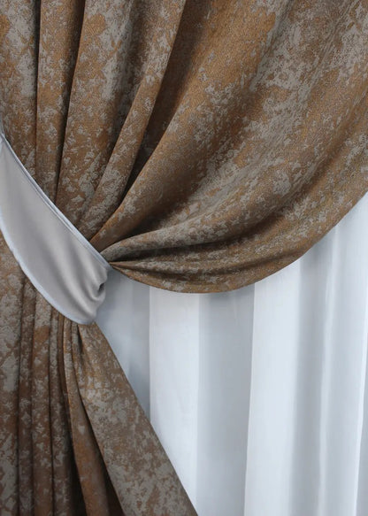 Softly textured copper and grey linen curtains with an elegant drape, perfect for bedrooms and refined interiors.
