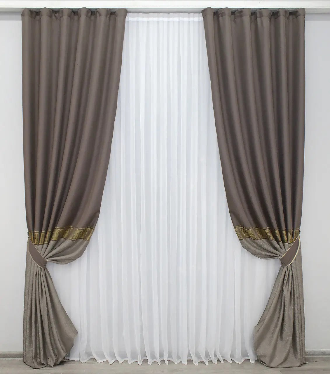 Dark cocoa drapes with rich golden accents, providing a sophisticated blend of warmth and contemporary style.
