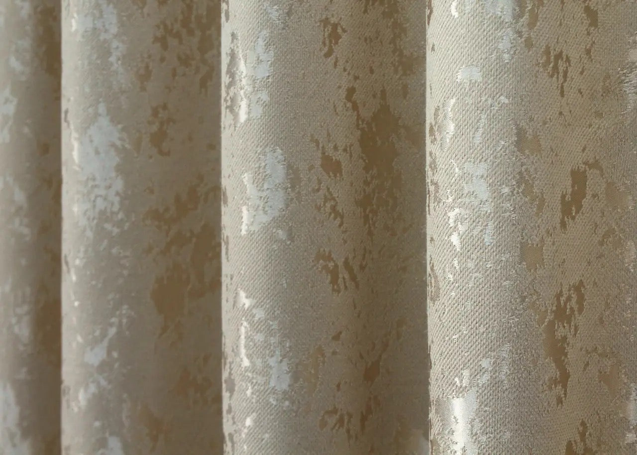 Classic beige linen drapes with a subtle pattern, enhancing the warmth of any home space.
