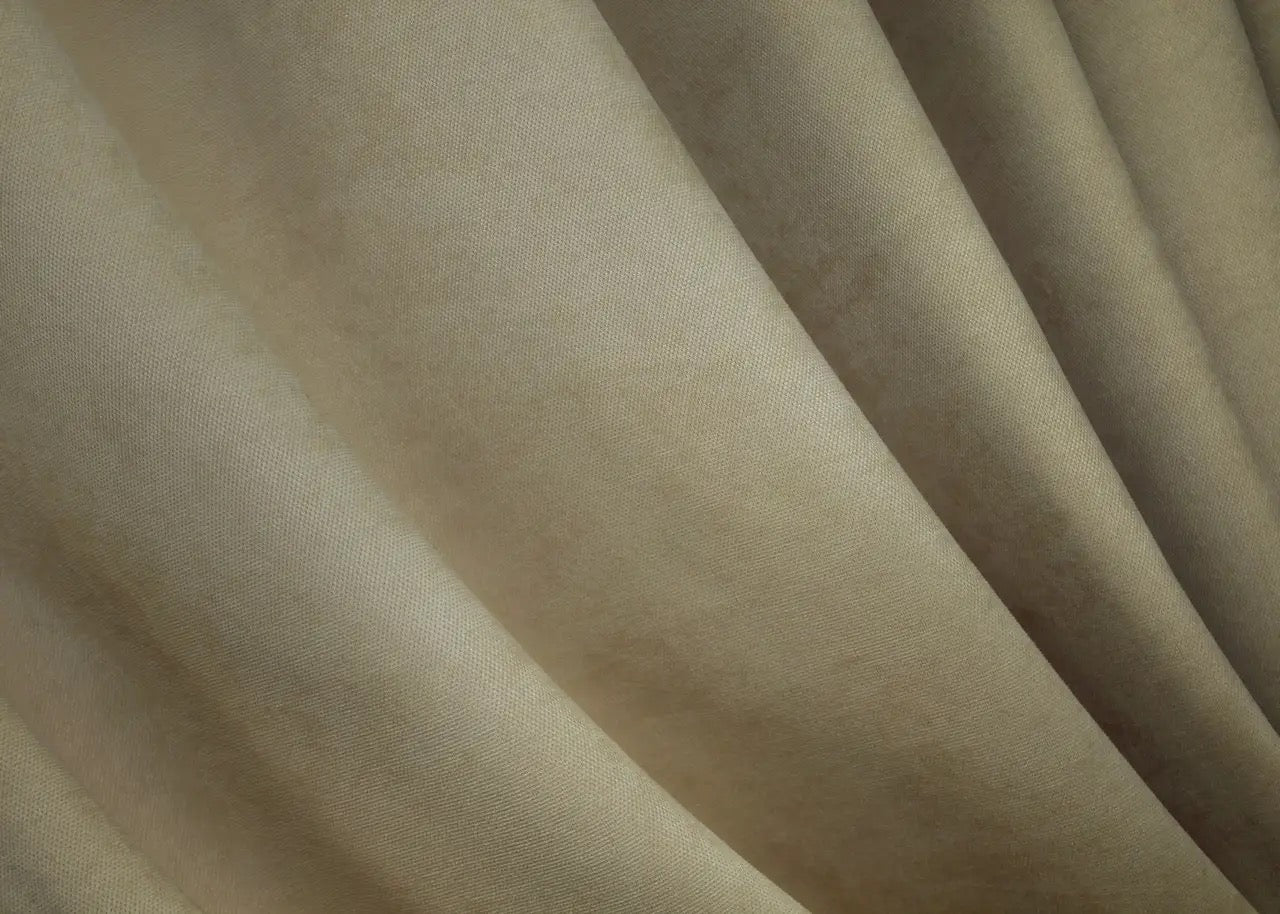 Soft-touch natural beige velvet curtains with a rich texture, perfect for home and hotel settings.
