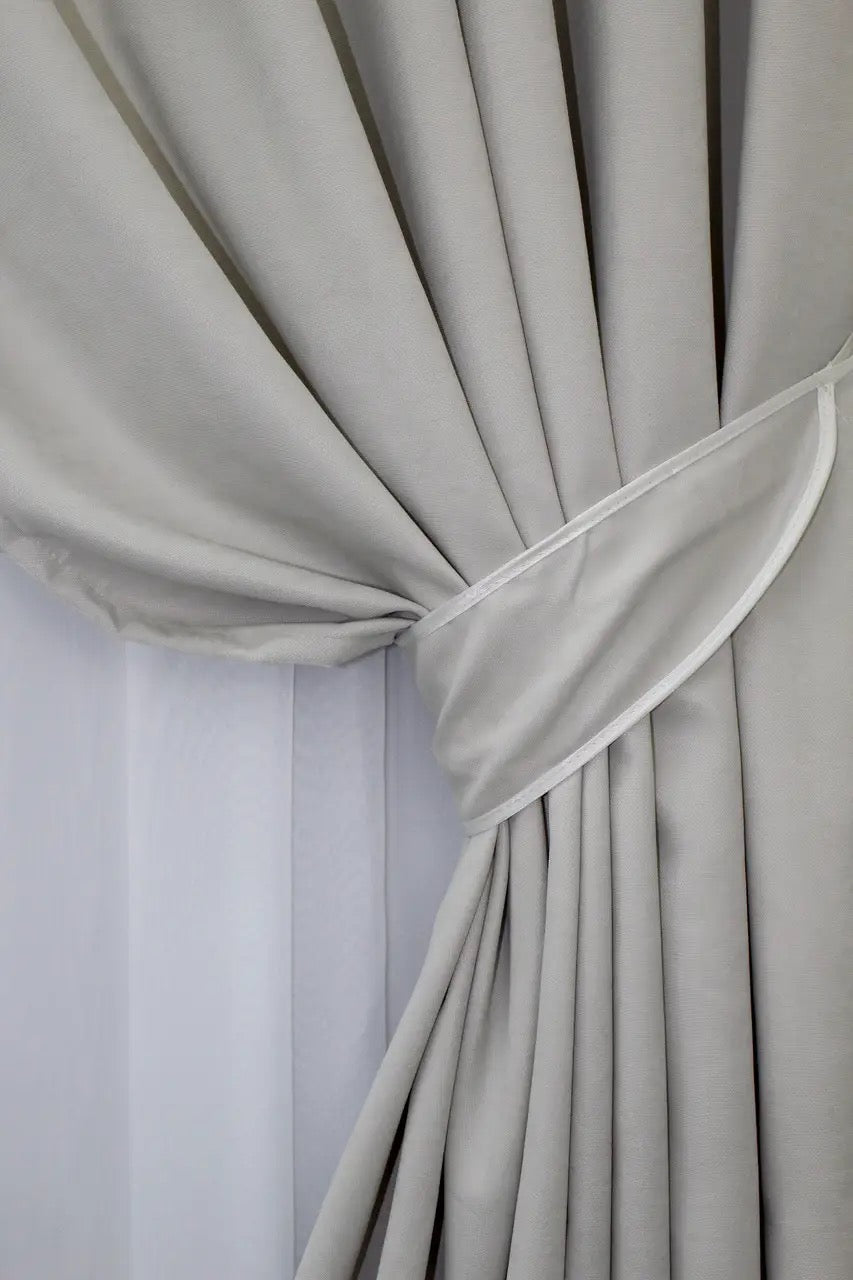 Timeless light grey microvelvet drapes, creating a sophisticated and inviting atmosphere in any home.
