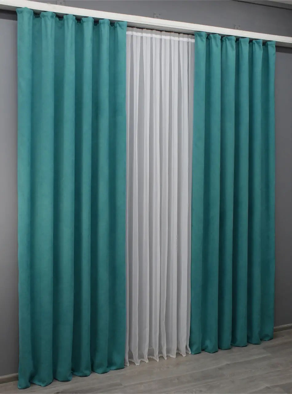 Sophisticated aqua microvelvet curtains, ideal for classic and contemporary décor.
