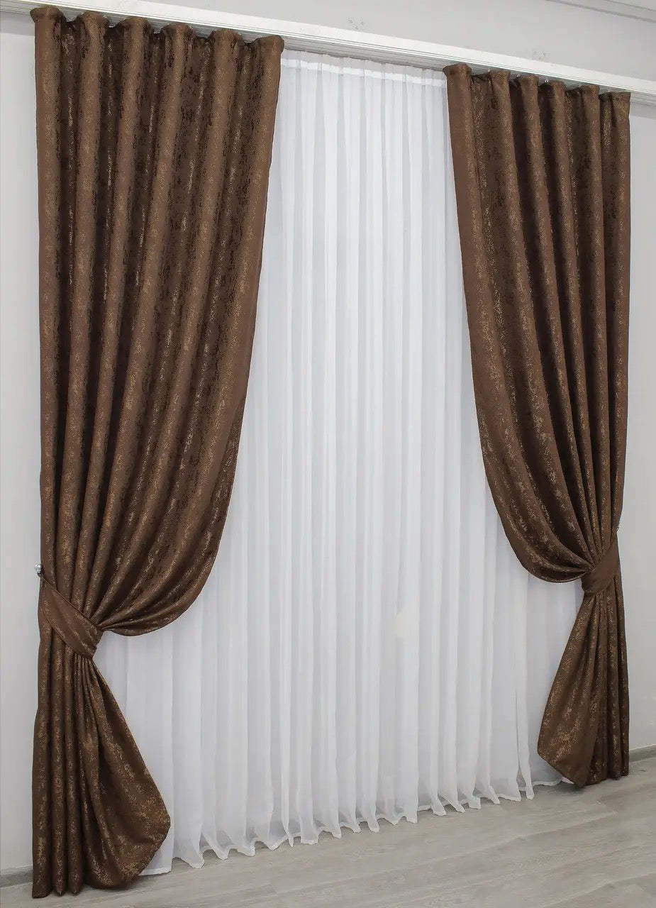 Elegant brown linen curtains with a textured finish, perfect for cosy and sophisticated interiors.
