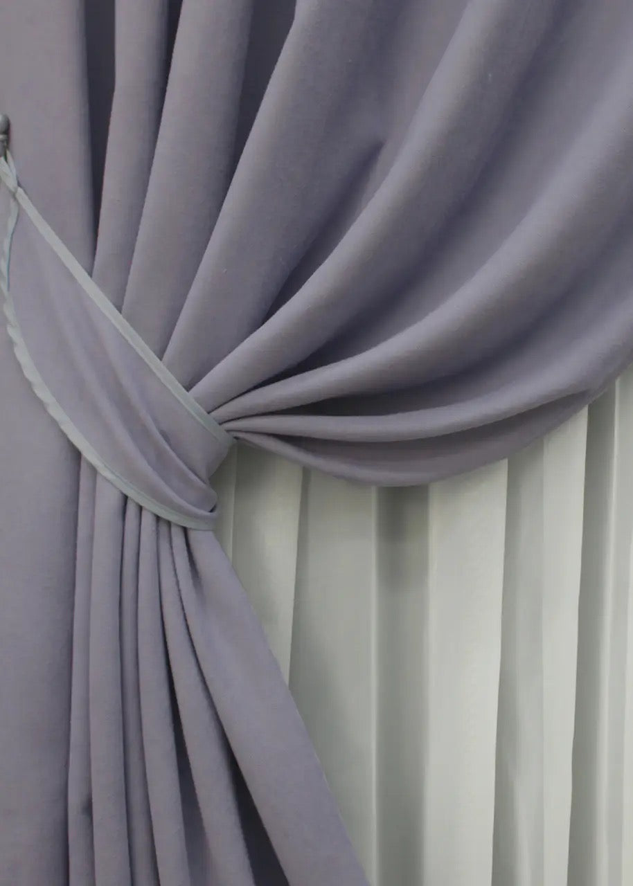 High-quality microvelvet curtains in lavender gray, providing privacy while enhancing natural light.
