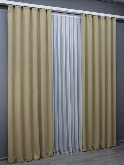 Sophisticated sand beige microvelvet curtains, ideal for classic and contemporary décor.
