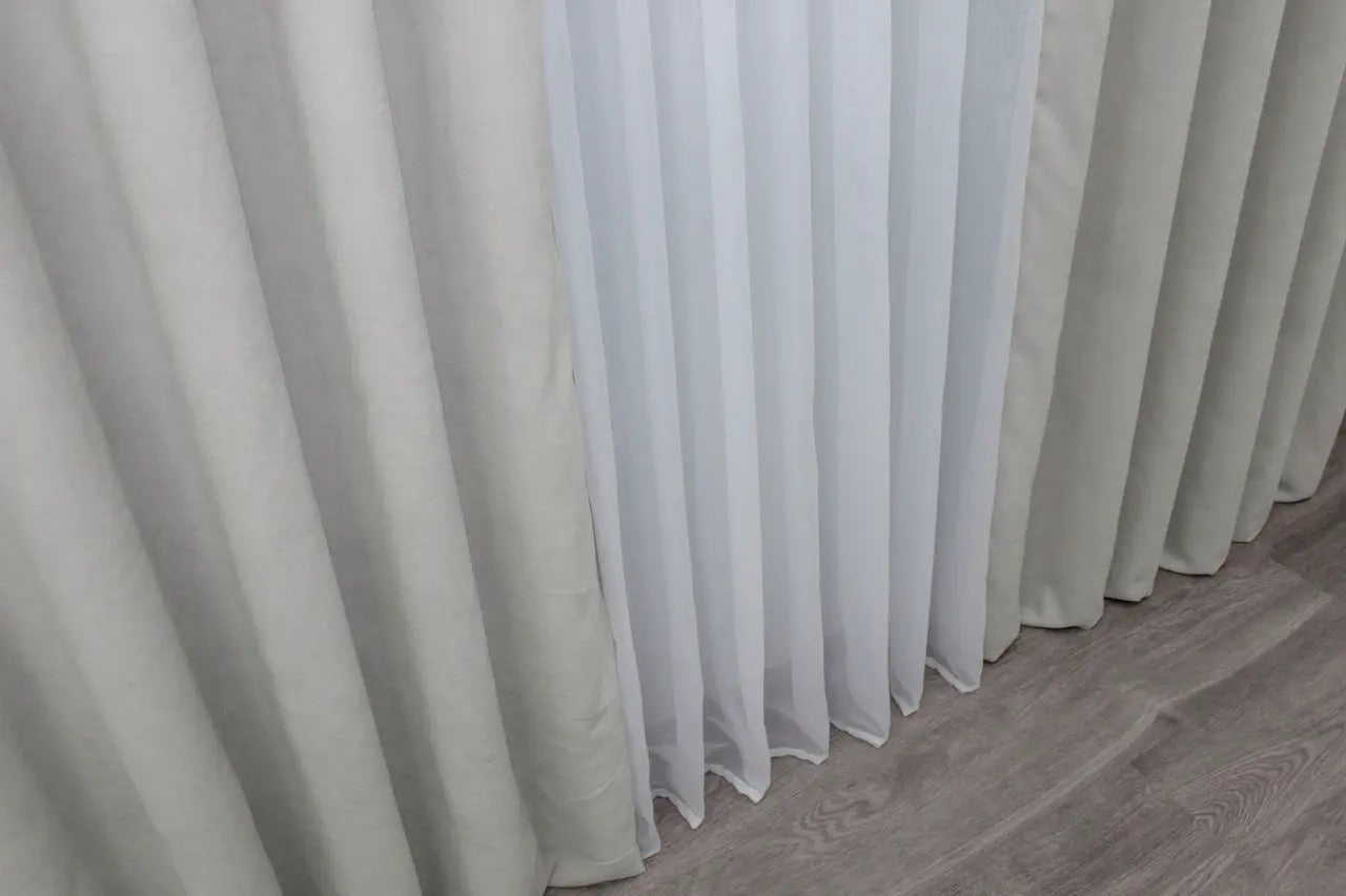 Luxury soft grey velvet curtains, ideal for light filtering and adding depth to any stylish décor.
