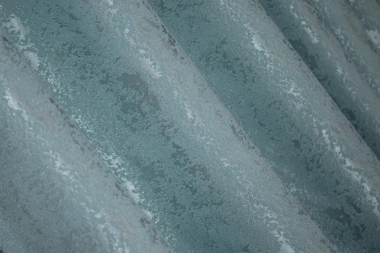 Contemporary sky blue marble-patterned linen curtains, ideal for minimalist and sophisticated interiors.
