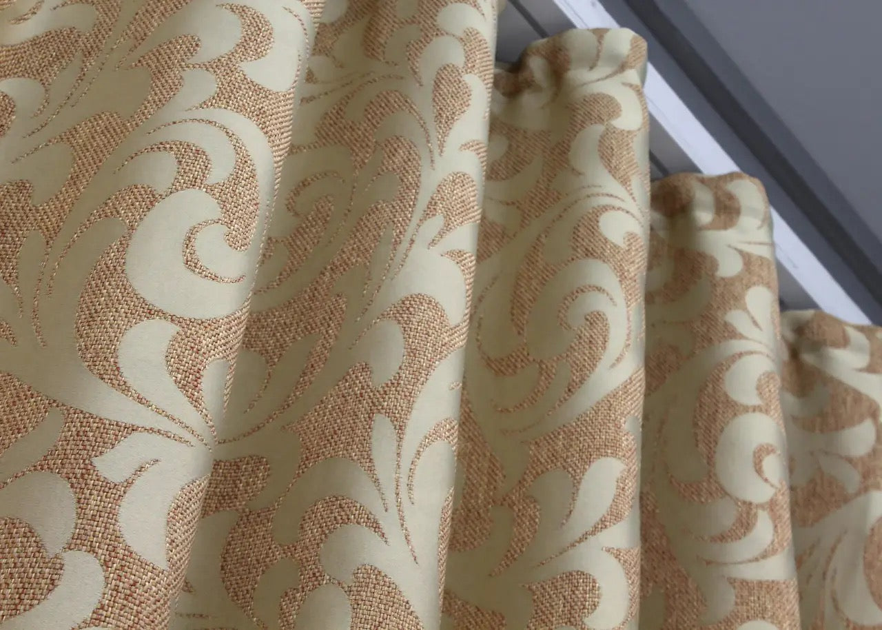 Classic linen curtains in beige with a sophisticated ornamental pattern for warm interiors.
