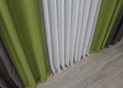 Striking grey-brown and lime green linen blackout curtains designed to add a lively contrast while maintaining a natural, cozy feel.
