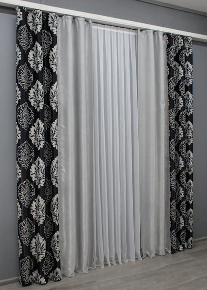 Stylish black and light grey two-tone blackout curtains perfect for any space in need of privacy, comfort, and elegance.
