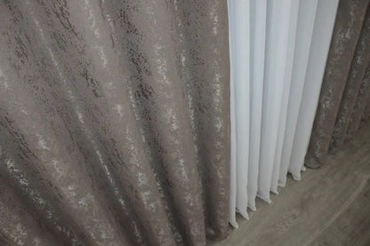 Classic brown-grey linen curtains with a smooth texture, enhancing natural light in modern and rustic interiors.
