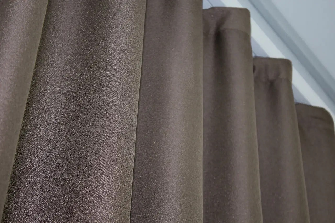 High-end linen curtains in cappuccino with gold accents, designed for upscale home interiors.
