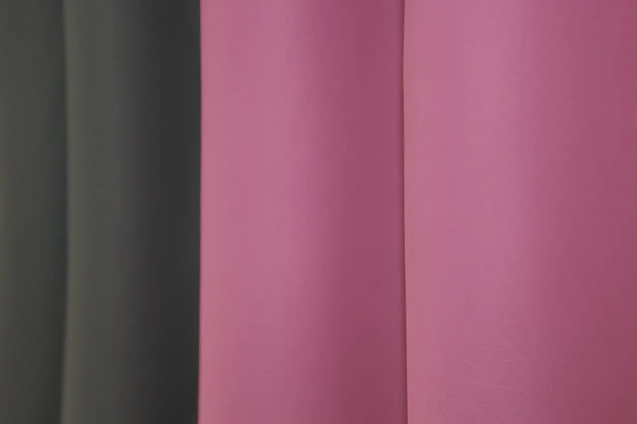 Dark grey (graphite) and mulberry (raspberry, fuchsia) combined blackout curtains featuring a bold yet refined contrast for luxury interiors.
