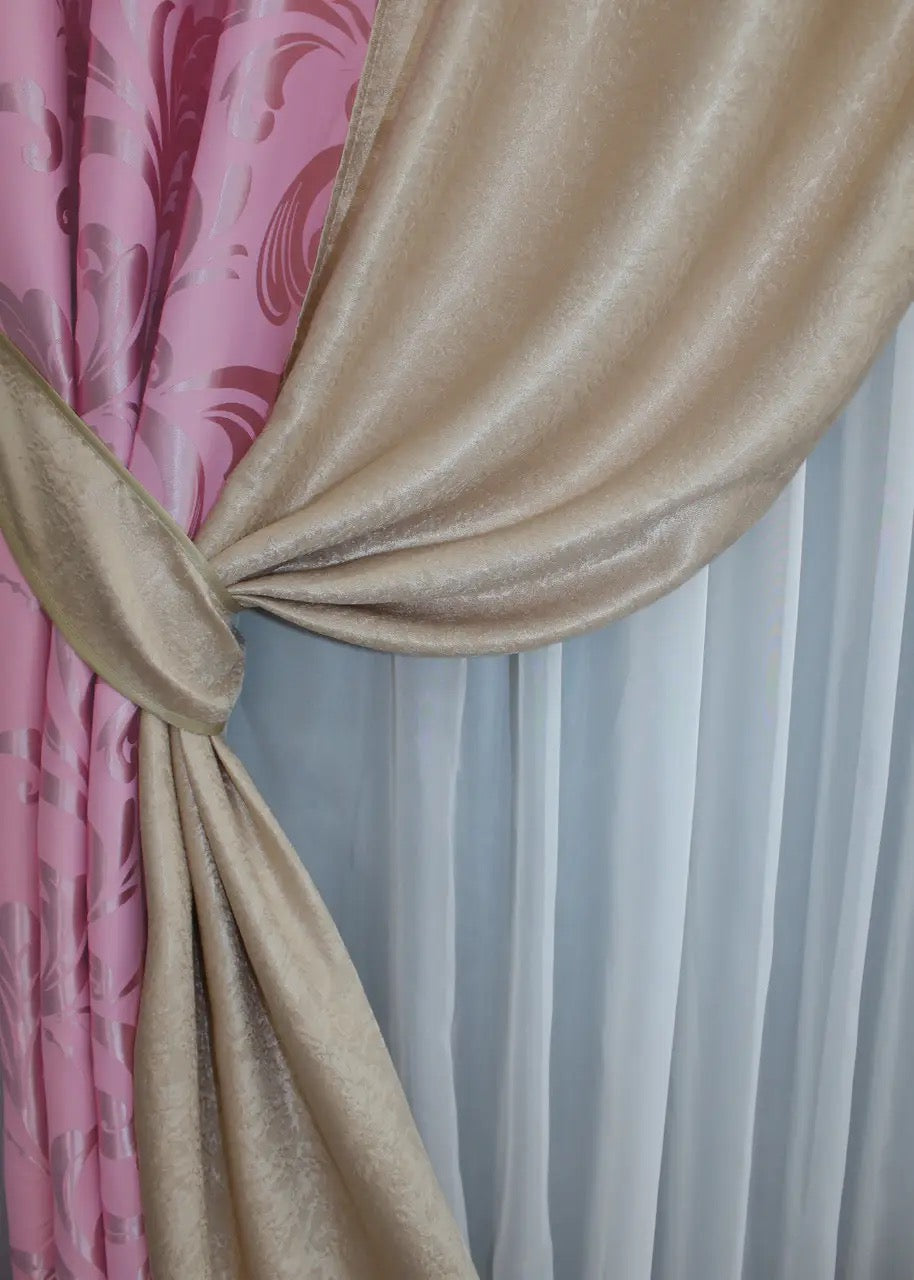 Stylish pink and beige combined blackout curtains with soft drape, ideal for contemporary interiors.
