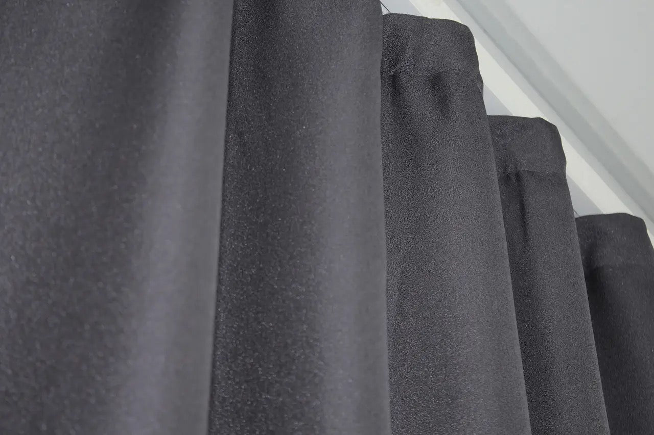 High-end linen curtains in dark grey with silver accents, designed for upscale home interiors.
