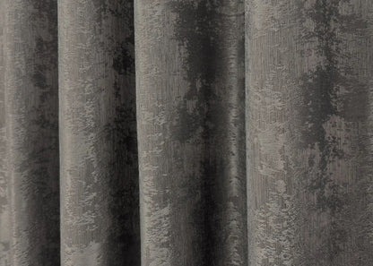 Opulent dark grey curtains with a textured jacquard design, bringing warmth and elegance to your home décor.
