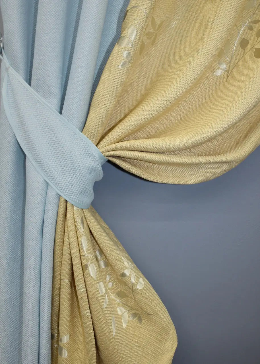 Stylish light blue and beige linen curtains, designed for a natural and cozy look, perfect for enhancing modern, relaxed interiors.
