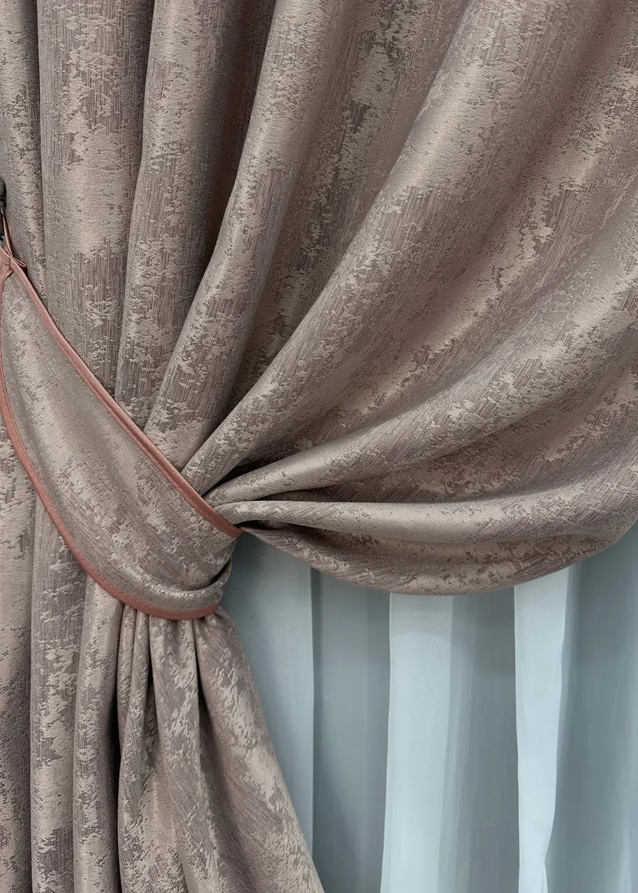 Opulent taupe jacquard curtains with a subtle beige undertone, creating a soft, inviting ambiance in any interior.
