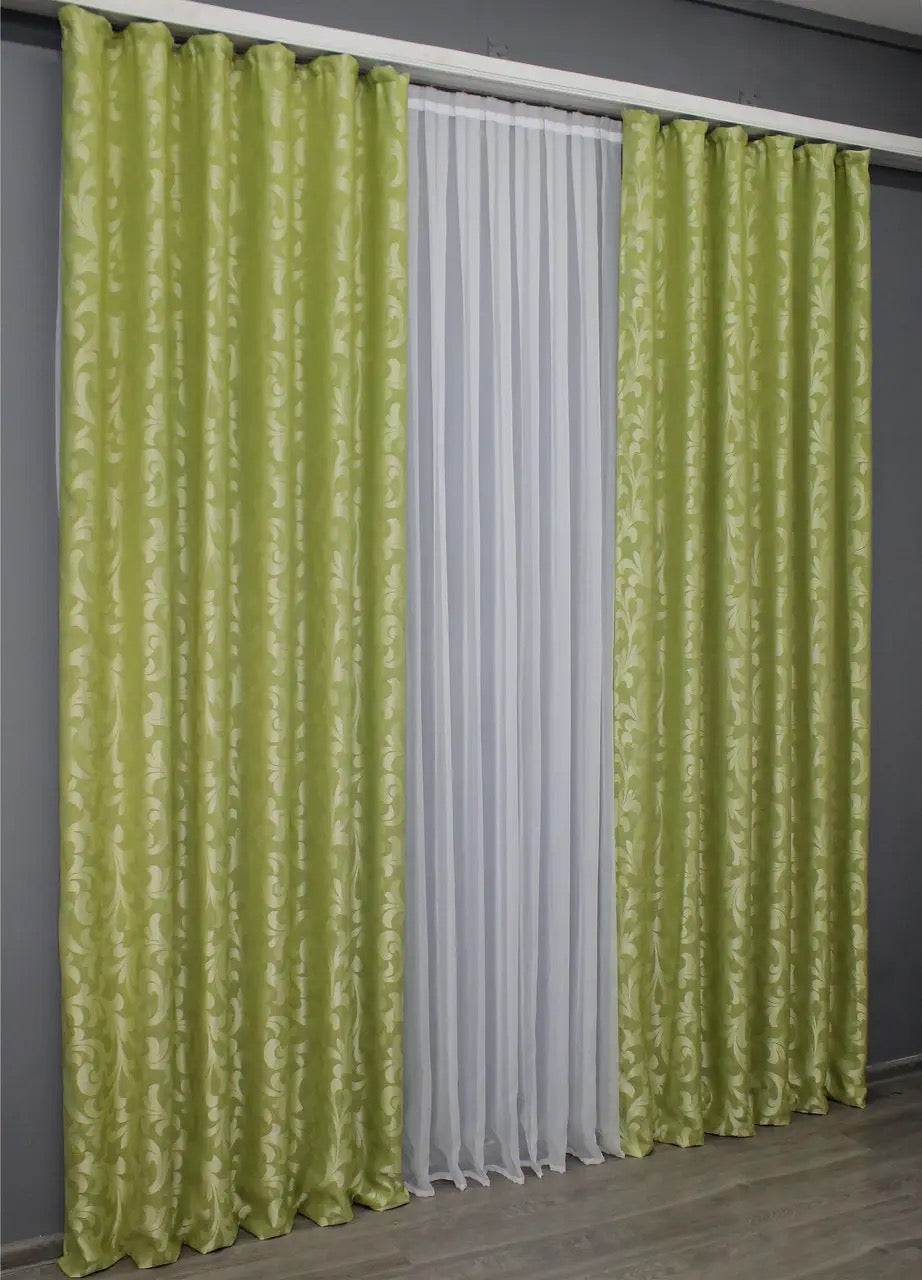 Stylish olive green Venzel curtains with a delicate ornamental weave, suitable for contemporary and traditional spaces.
